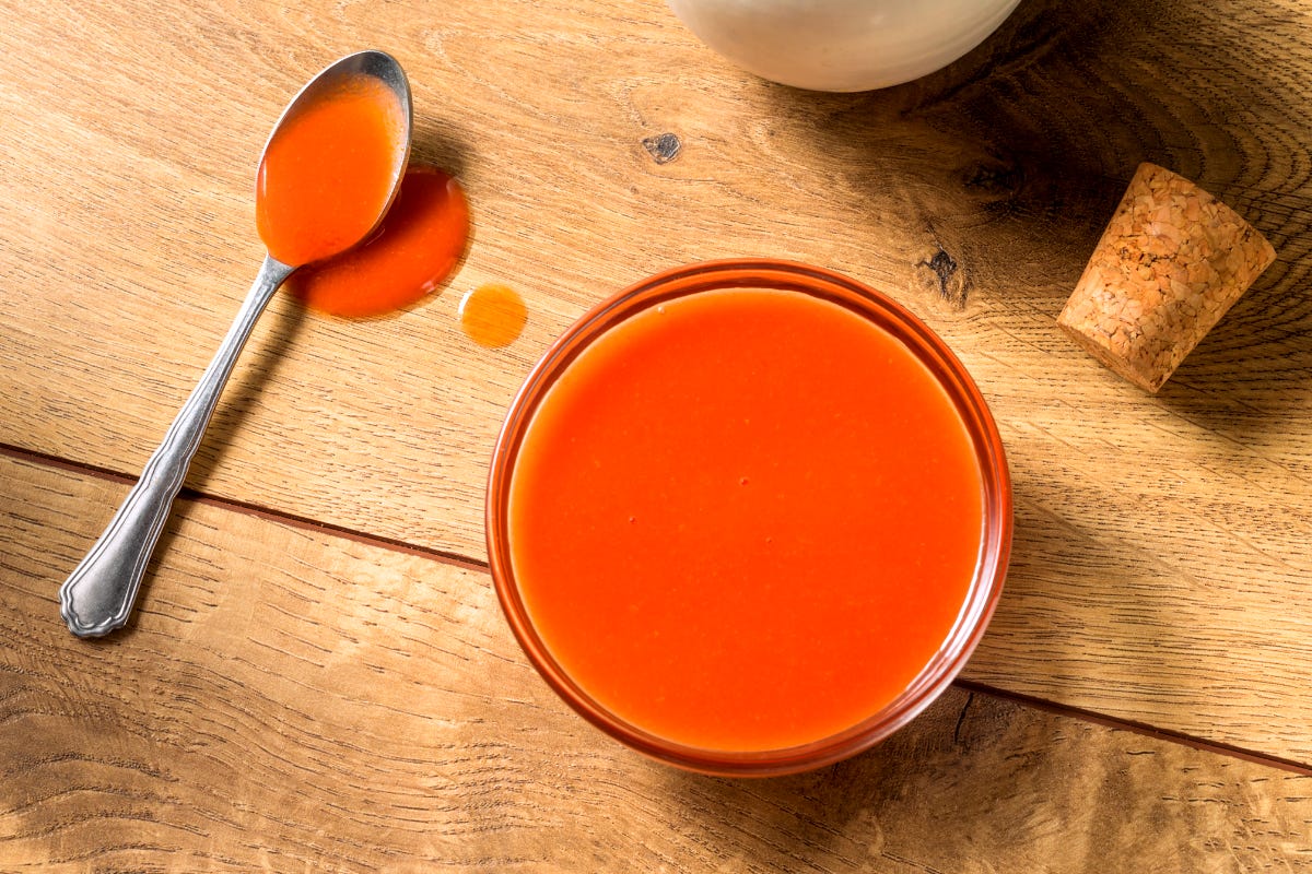 A bowl of homemade honey-kissed buffalo sauce, showing its rich, glossy texture. A simple and spicy recipe made with Frank's RedHot and butter. A bowl of homemade honey-kissed buffalo sauce, showing its rich, glossy texture. A simple and spicy recipe made with Frank's RedHot and butter.