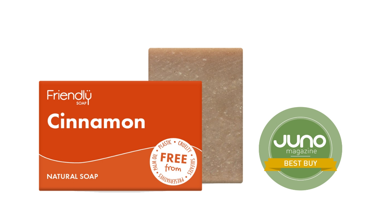 Cinnamon Natural Soap from Friendly Soap, shown next to its orange packaging on a white background, with the JUNO Best Buy badge