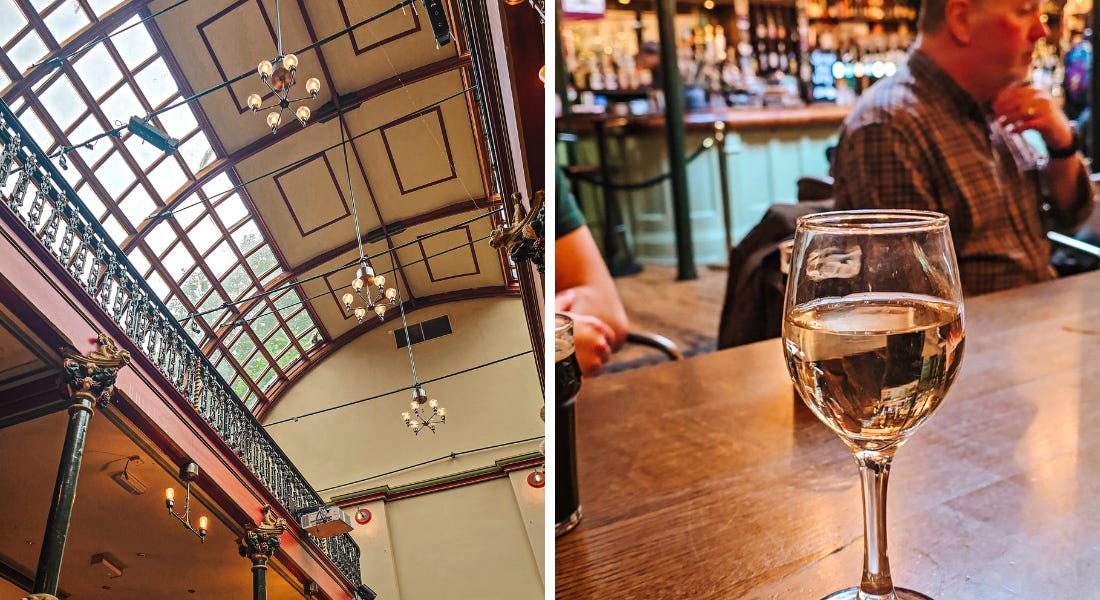 Two pictures - one of an arched ceiling with glass panels and a balcony, and one of a glass of white wine on a wooden table