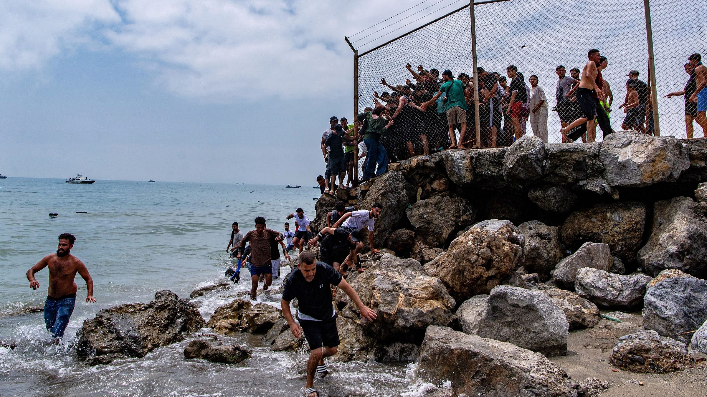 Migrants cross from Morocco into the Spanish enclave of Ceuta, Thursday, July 30, 2026. (AP Photo/Antonio Sempere) Migrants cross from Morocco into the Spanish enclave of Ceuta, Thursday, July 30, 2026. (AP Photo/Antonio Sempere)