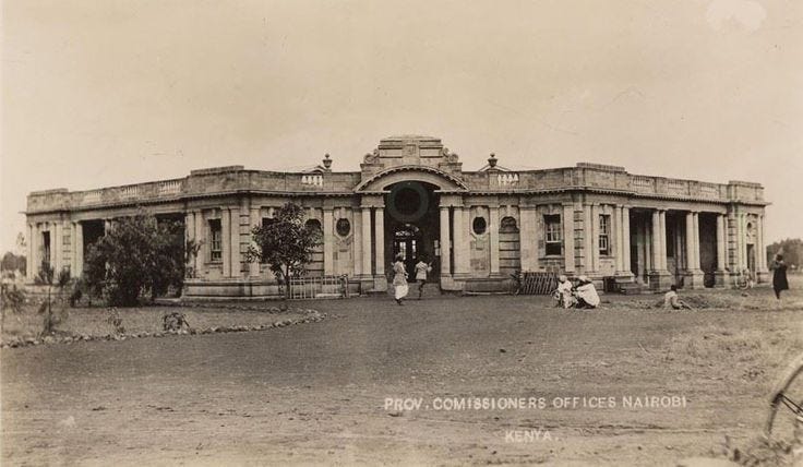 This may contain: an old black and white photo of people in front of a building