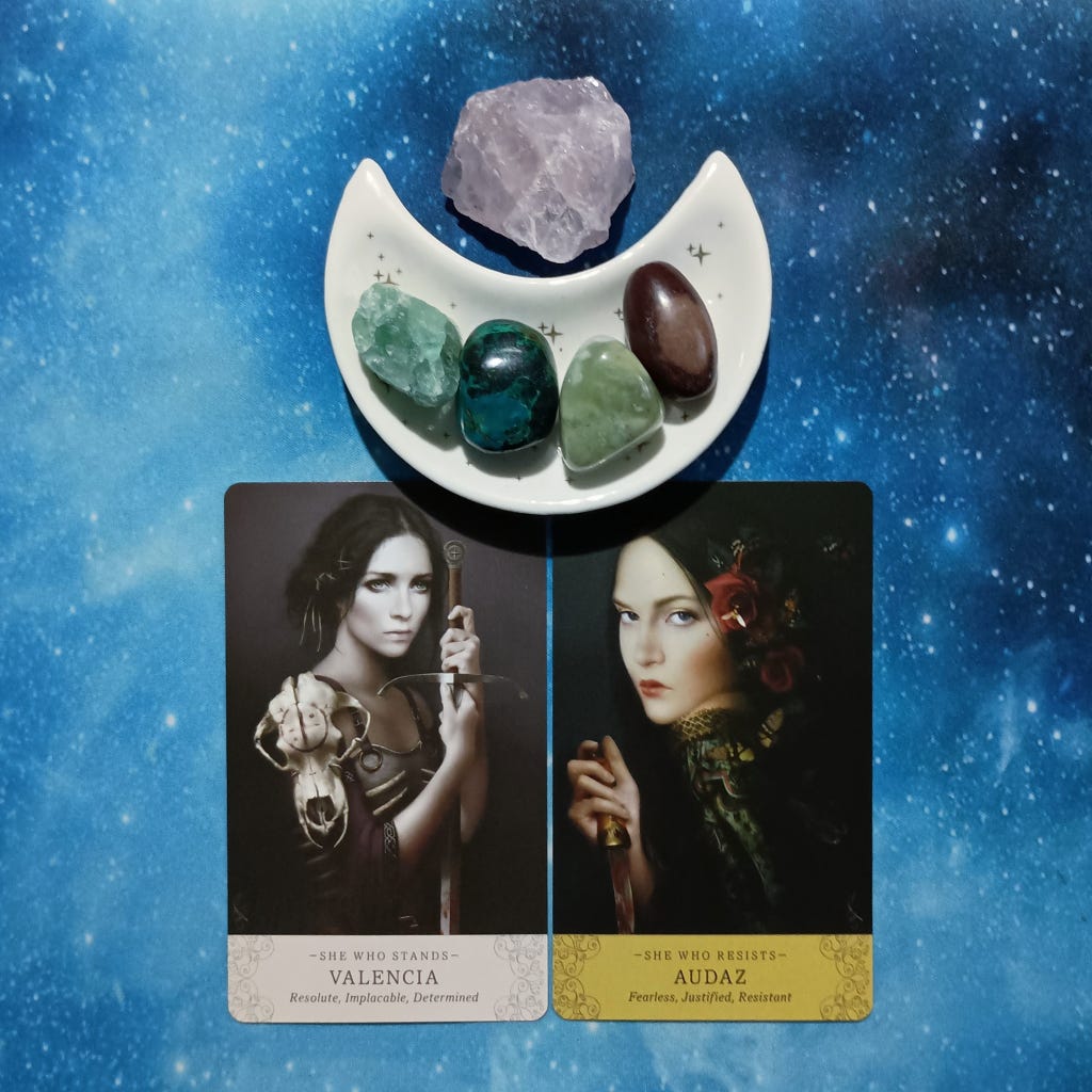 Finding Joy in Hard Times ~ A Message From the Universe, 2 Elle Qui Oracle cards and crystals on a starry blue background