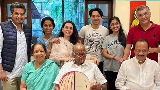 Sharad Pawar (seated centre) is flanked by his wife Pratibha and Ajit Pawar. Standing, from left: Pawar’s grandnephew and MLA from Karjat-Jamkhed Rohit Pawar; Sharad Pawar’s daughter Supriya Sule; her children Revati and Vijay with an unidentified cousin; and extreme right is Supriya’s husband Sadanand Sule. (BY ARRANGEMENT)