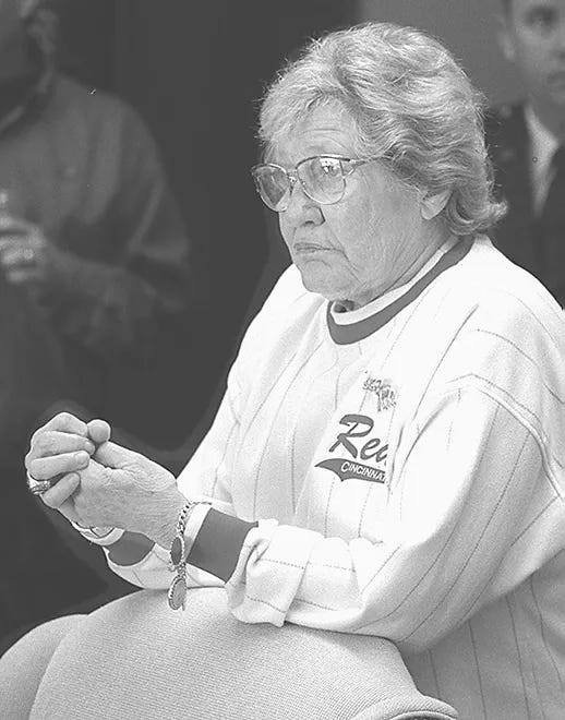 Marge Schott watching in her skybox.