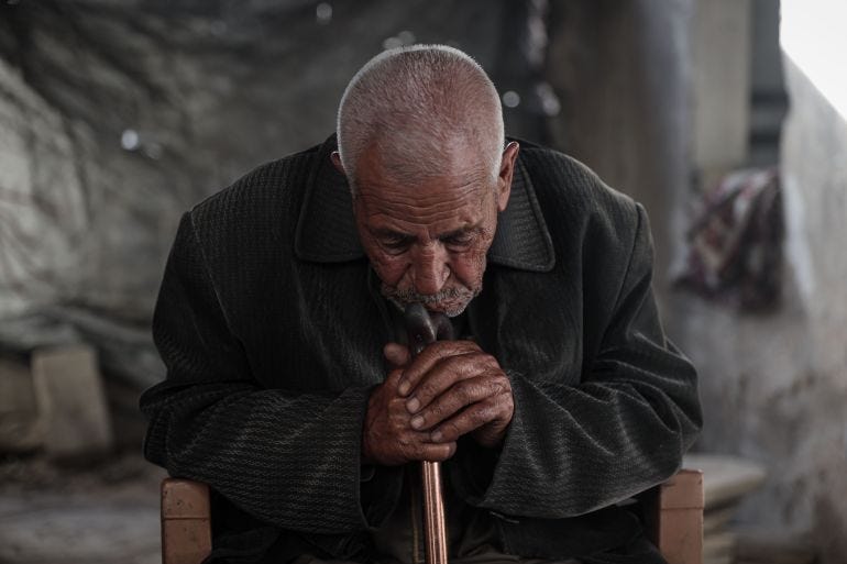Abdel Mahdi al-Wuheidi holding his stick