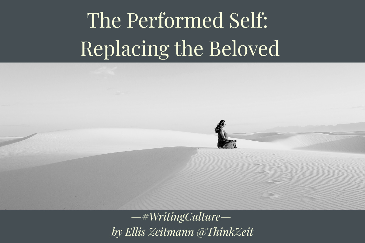 Black and white photograph of a woman seated alone on vast white sand dunes, turned slightly away, hair caught by the wind, her own footprints trailing behind her across the rippled surface. Overlaid with the series title 'The Performed Self' and the hook 'Replacing the Beloved.' Part of The Performed Self series on the impossibility of escaping self-construction.