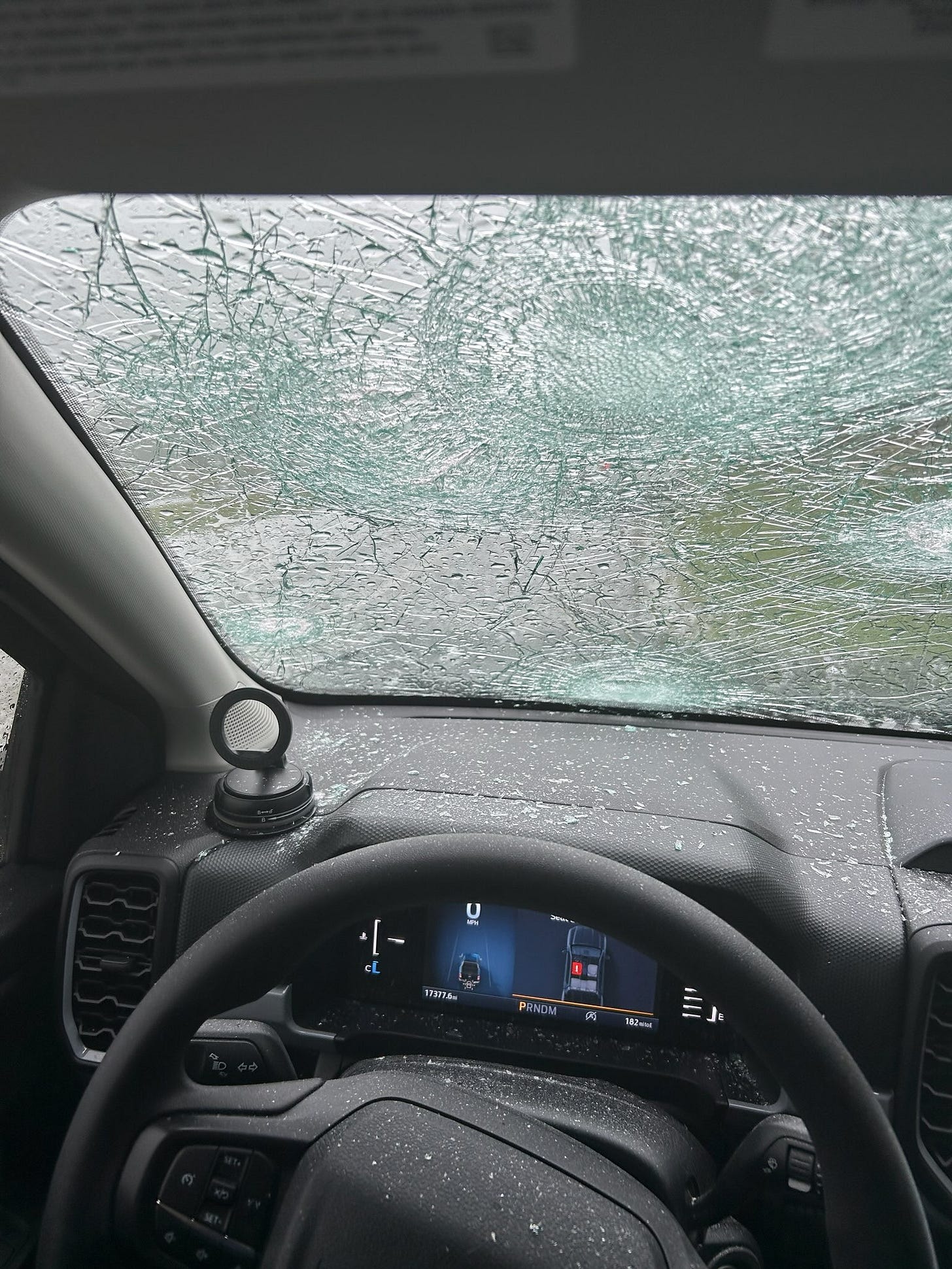 May be an image of jeep, car and body of water