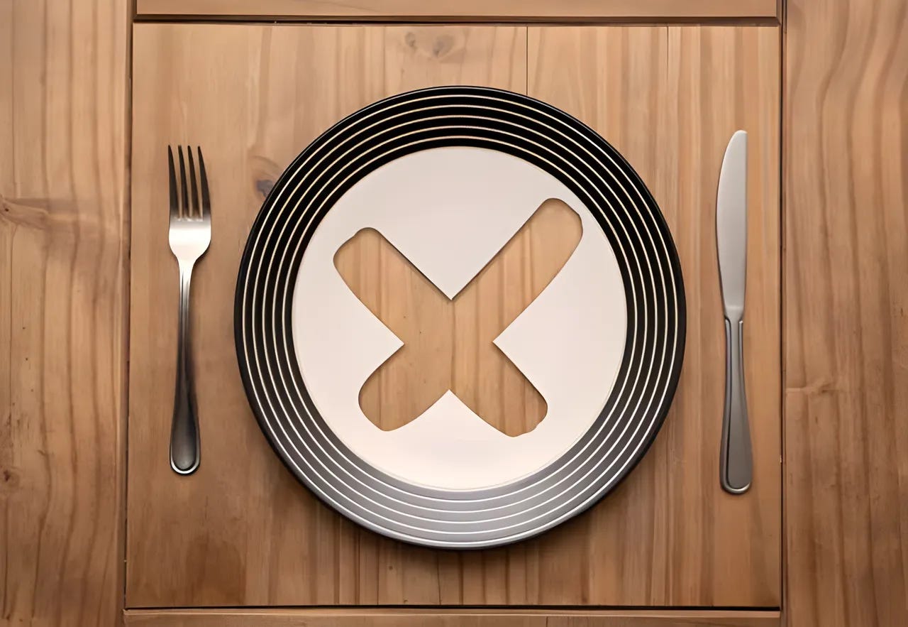 Fork, knife, and plate on wooden background. The plate has a large X cut out of the center. Fork, knife, and plate on wooden background. The plate has a large X cut out of the center.