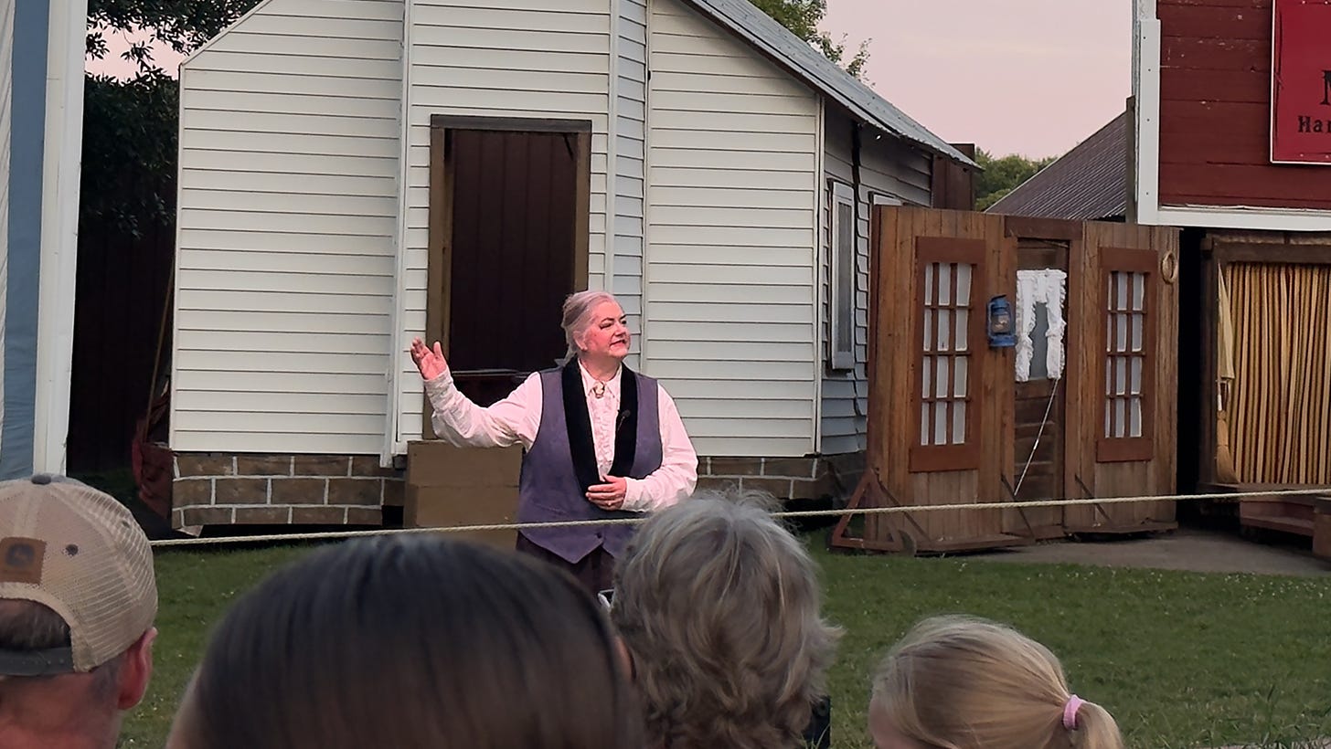 An actor cast as Laura Ingalls Wilder after she became an author, narrates the beginning of the play.