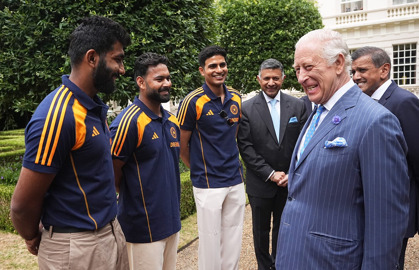 King Charles laughing