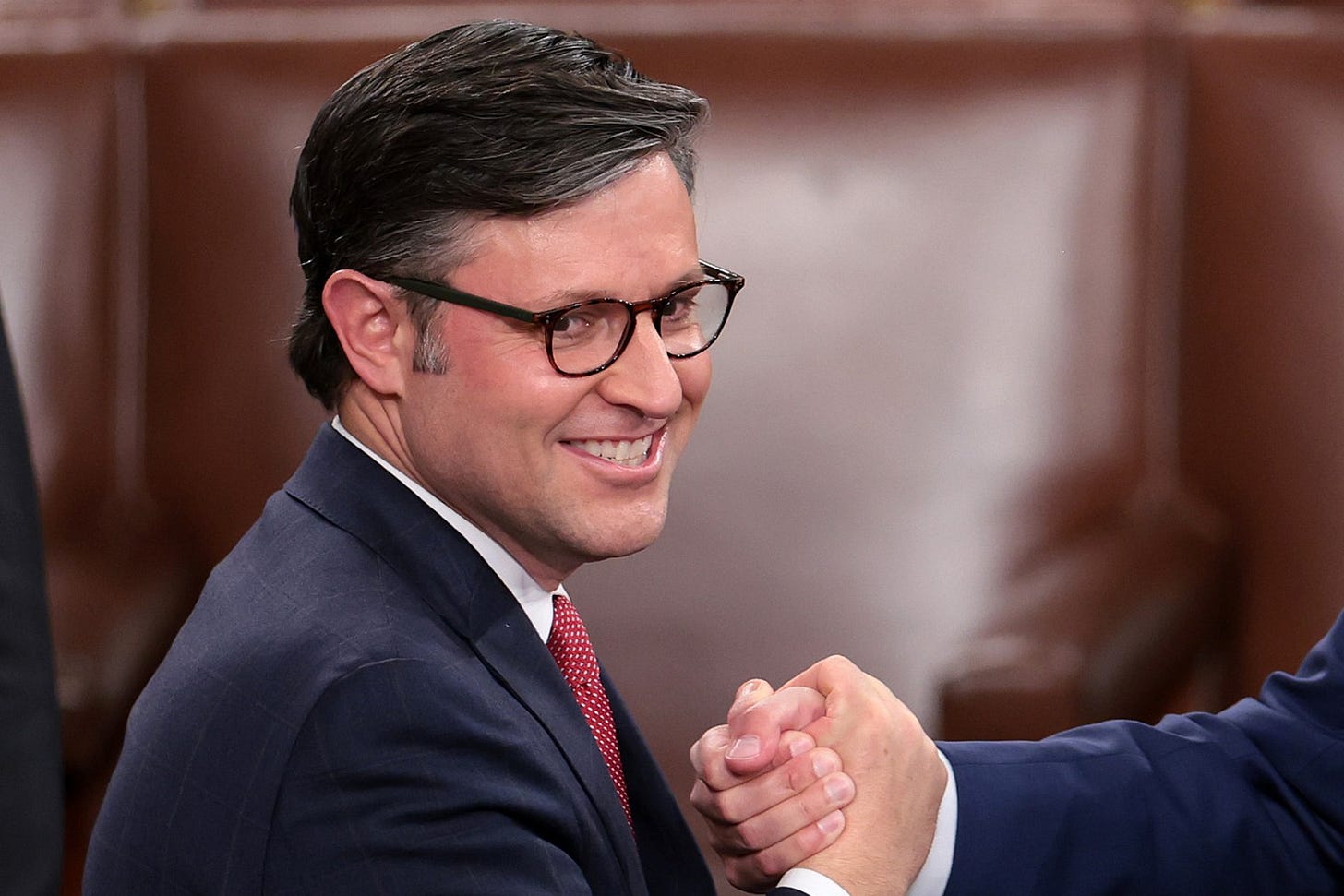 WASHINGTON, DC - OCTOBER 25: U.S. Rep. Mike Johnson (R-LA) (L) shakes hands with Rep. Andy Barr (R-KY) as the House of Representatives holds an election for a new Speaker of the House at the U.S. Capitol on October 25, 2023 in Washington, DC. After a contentious nominating period that has seen four candidates over a three-week period, the House GOP conference selected Johnson as their most recent nominee to succeed former Speaker Kevin McCarthy (R-CA), who was ousted on October 4 in a move led by a small group of conservative members of his own party. (Photo by Win McNamee/Getty Images) WASHINGTON, DC - OCTOBER 25: U.S. Rep. Mike Johnson (R-LA) (L) shakes hands with Rep. Andy Barr (R-KY) as the House of Representatives holds an election for a new Speaker of the House at the U.S. Capitol on October 25, 2023 in Washington, DC. After a contentious nominating period that has seen four candidates over a three-week period, the House GOP conference selected Johnson as their most recent nominee to succeed former Speaker Kevin McCarthy (R-CA), who was ousted on October 4 in a move led by a small group of conservative members of his own party. (Photo by Win McNamee/Getty Images)