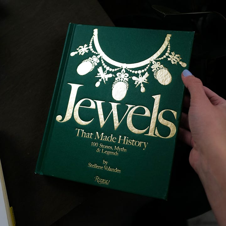 Two photos with cover and interior of the book on jewelry.
