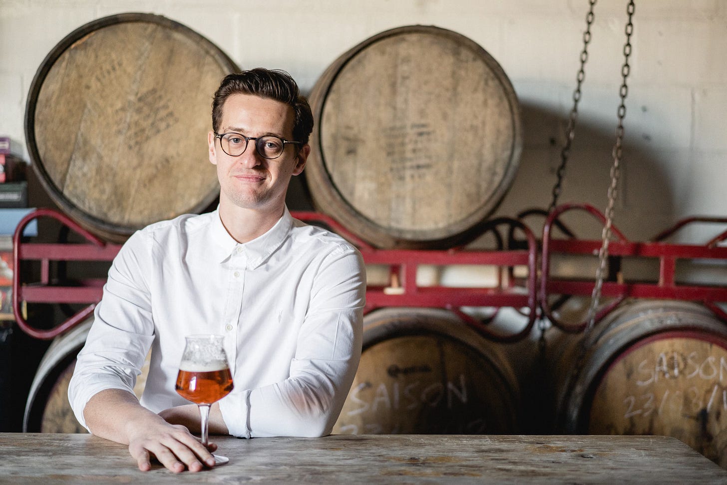 Neil Walker with a glass of barrel aged beer