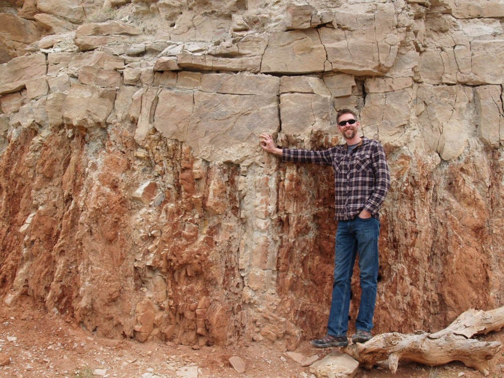 UGS geologist Michael Vanden Berg marks the Salina Canyon unconformity that exhibits slight topographical irregularities; the uneven erosional surface was preserved when deposition resumed as the Flagstaff Limestone. UGS photo: Rebekah Stimpson.