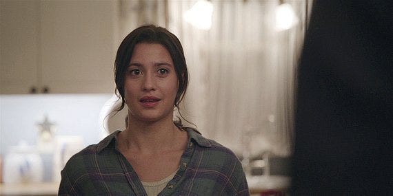 Cassie looking and smirking at walker. Cassie looking and smirking at walker.