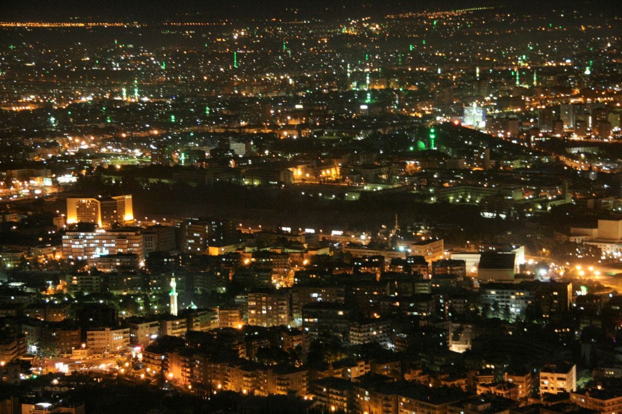 Damascus illuminated at night, seen from Mount Qasioun