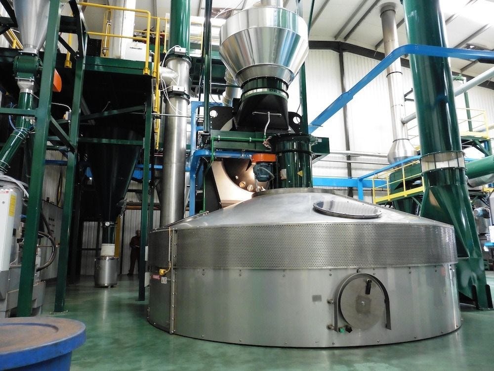 Industrial coffee roaster inside a specialty coffee roasting facility Industrial coffee roaster inside a specialty coffee roasting facility
