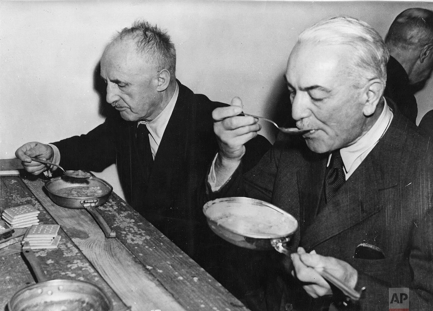 A rare glimpse of humanity amid the trials: Former German Foreign Minister Dr. Konstantin von Neurath and Nazi propagandist Julius Streicher eat lunch from U.S. Army mess tins on a bare table within Nuremberg's Palace of Justice, November 29, 1945. A rare glimpse of humanity amid the trials: Former German Foreign Minister Dr. Konstantin von Neurath and Nazi propagandist Julius Streicher eat lunch from U.S. Army mess tins on a bare table within Nuremberg's Palace of Justice, November 29, 1945.
