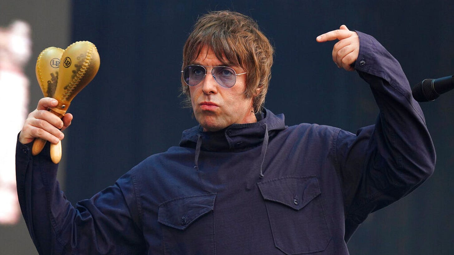 Liam Gallagher drinks half a bottle of brandy before going on stage - and  finishes it while he's up there | Ents & Arts News | Sky News