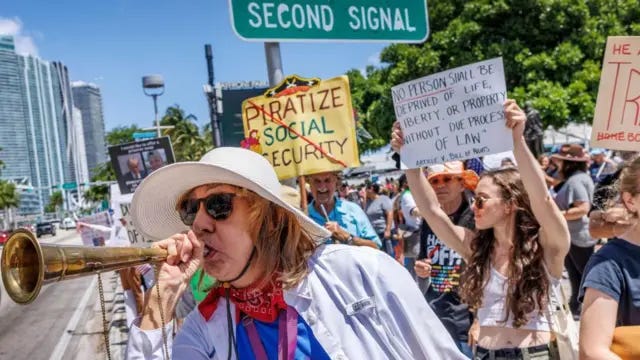 Protestors line a Florida street