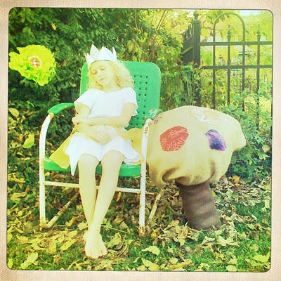 A picture of a little girl in a crown with a magical mushroom, and a drawing with watercolor of a little girl as a fairy.