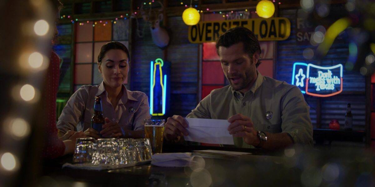 Walker Cordell reading letter at side step bar Walker Cordell reading letter at side step bar