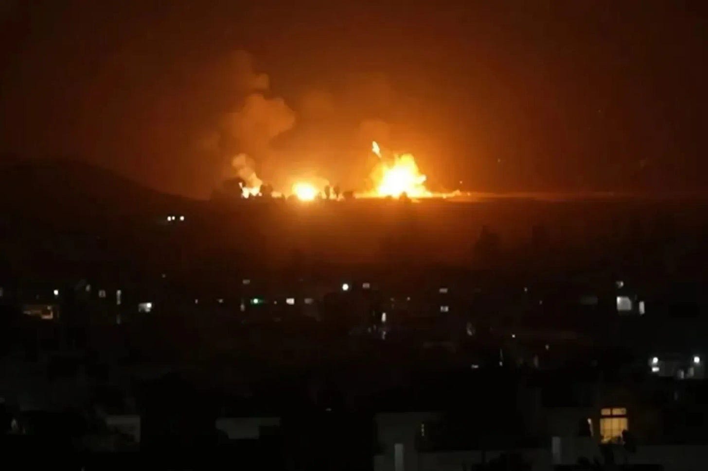 Moment airstrike explosions light up sky over Syria as Israel ...