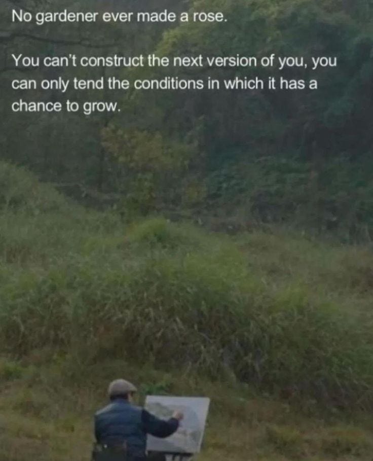 This may contain: a man sitting on top of a bench next to a forest