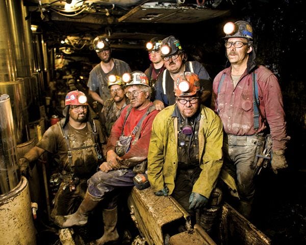 This may contain: a group of men wearing hard hats and safety gear