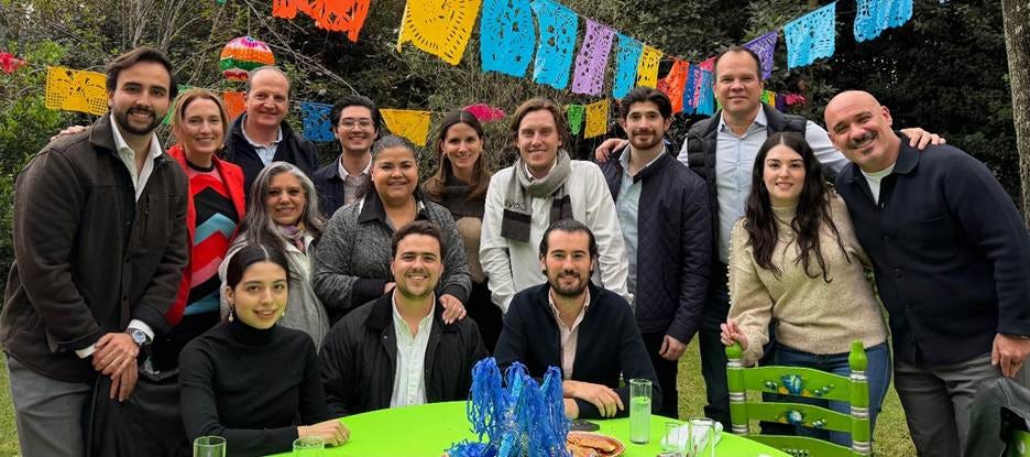 A group of people posing for a photo

AI-generated content may be incorrect.