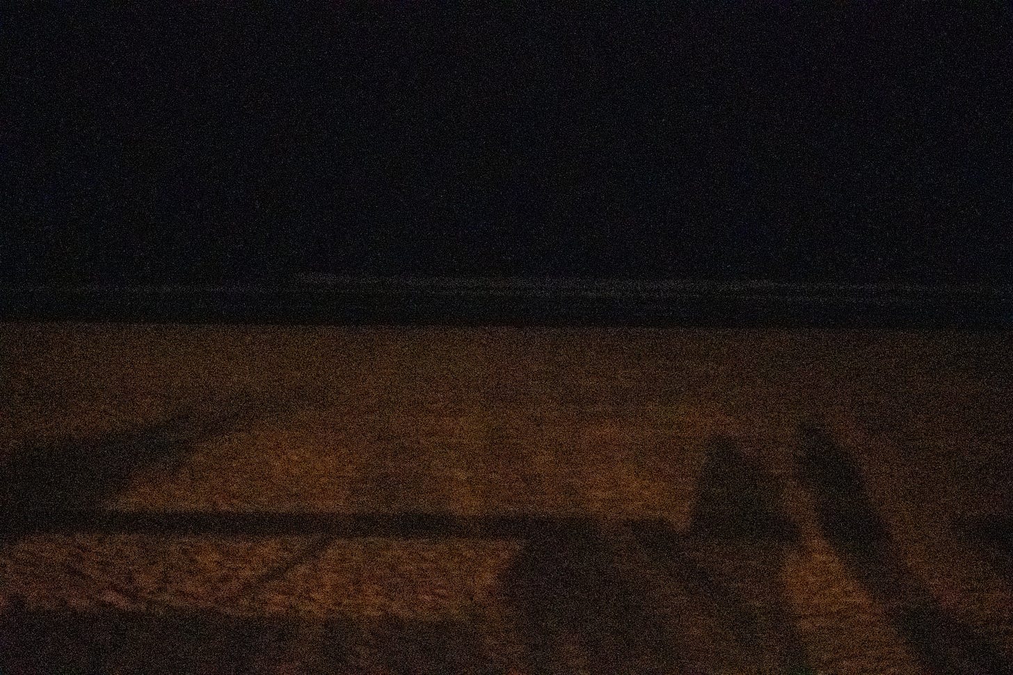 Silhouettes on the Beach at Night