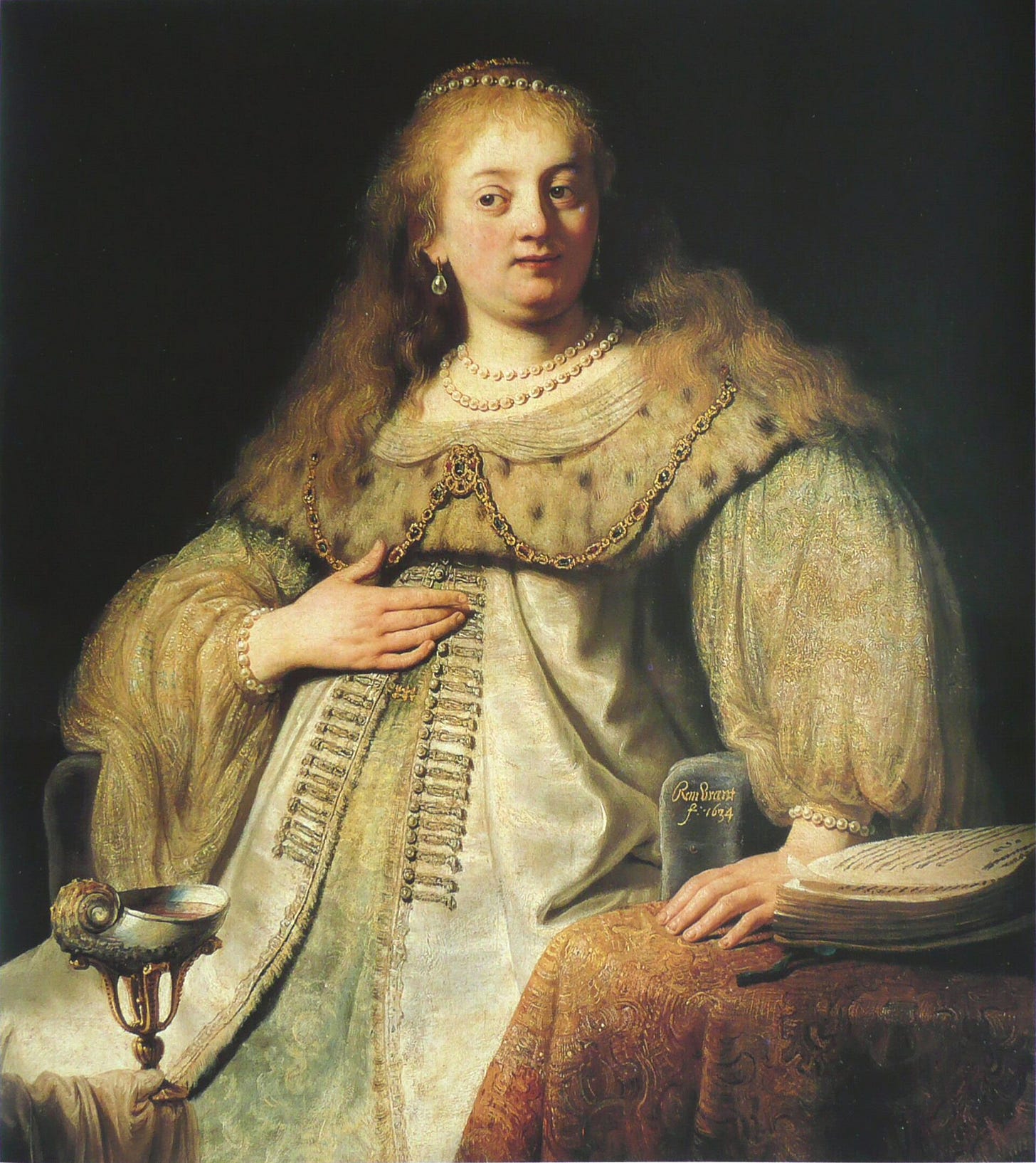 A richly dressed young woman with pearls in her hair sits at a table covered with a carpet, her hand on her chest, as a young servant offers her a gilded cup. Behind her, an old woman holds a cloth bag in the shadows.