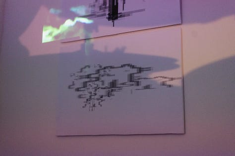 Images of performances in gallery space with artists using various types of sound and projection equipment  