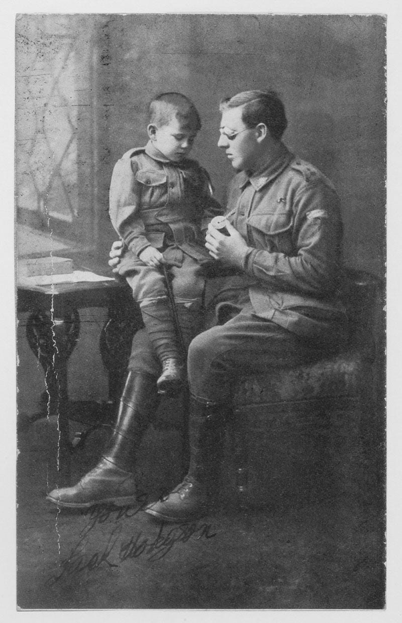 Jack Hodgson, an Australian soldier from the 4th Battalion, pictured with his son. He was left blind after being wounded at Gallipoli in 1915 during WWI, a poignant testament to the war's toll.
