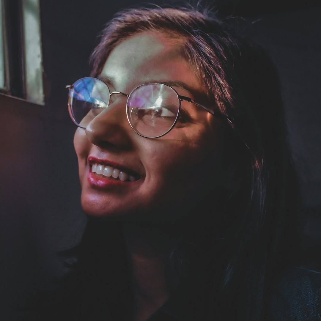 woman wearing silver framed eyeglasses