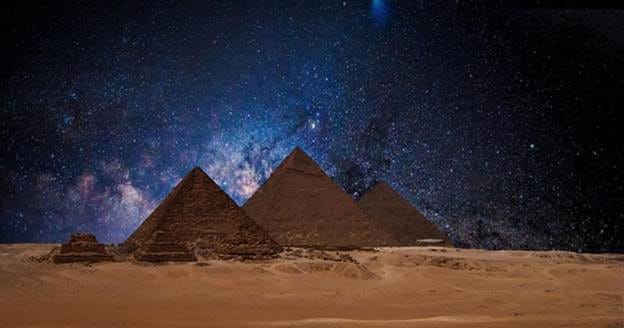 Egyptian pyramids under a night sky. Several researchers believe astronomical alignments at this site point to signs of an ancient advanced civilization.