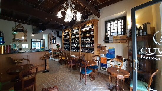 A priest saying Mass amid Roman ruins, the entrance to grandiose Renaissance-era Villa Farnesina; the fountain that dominates Piazza Santa Maria; the small dining room at Cuverie enoteca.