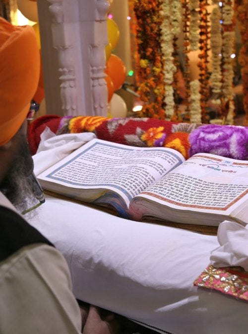 Beawar, Rajasthan, Jan 20,2021: Sikh priest reading the Guru Granth Sahib (Sikh holy book) on the occassion of birth anniversary of Guru Gobind Singh at holy gurudwara in Beawar. (Shutterstock, Sumit Saraswat)