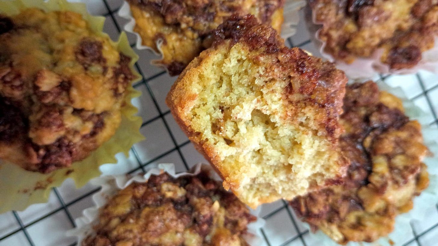 cinnamon swirl muffins on cooling rack.
