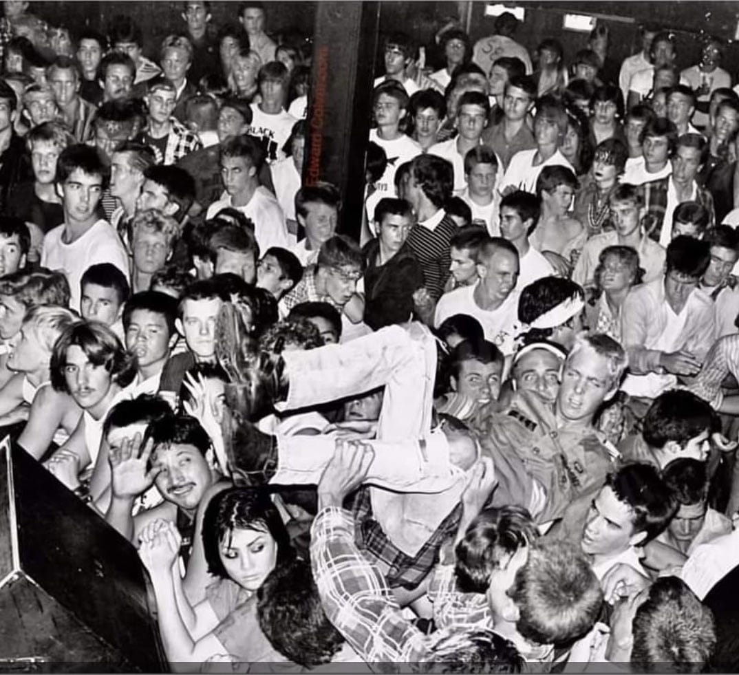 Crowd at a Circle Jerks show, 1982. Naomi bottom left. Photo by Ed Colver.