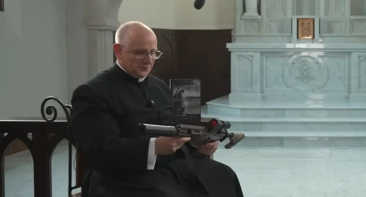 Fr. Chad Ripperger holds a rifle in the chapel of the Doloran Fathers
