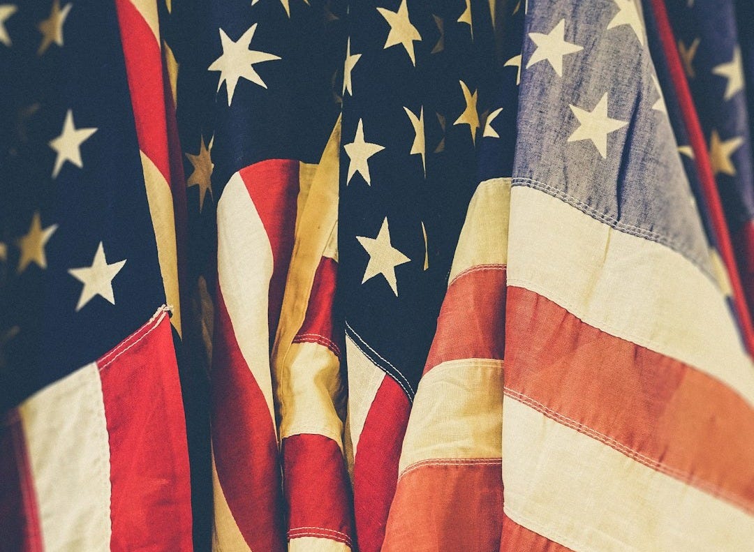 closeup photo of United States of America flag closeup photo of United States of America flag