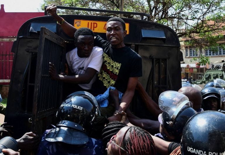 Ugandan police officers detain protestors during a rally against what the protesters say are rampant corruption and human rights abuses by the country's rulers in Kampala, Uganda Ugandan police officers detain protestors during a rally against what the protesters say are rampant corruption and human rights abuses by the country's rulers in Kampala, Uganda
