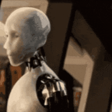 a close up of a robot 's head and shoulder . a close up of a robot 's head and shoulder .