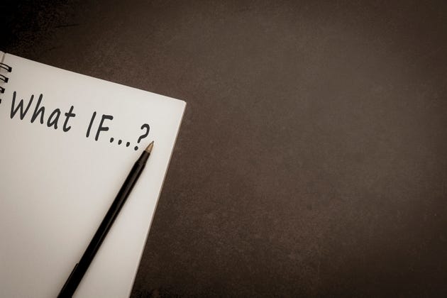 What If text on notepad with dark background What If text on notepad with dark background