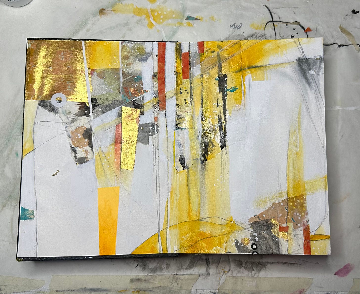 Sketchbook spread showing abstract mixed-media painting in yellow and shades of black and white- with metallic gold accents- Vertical shapes