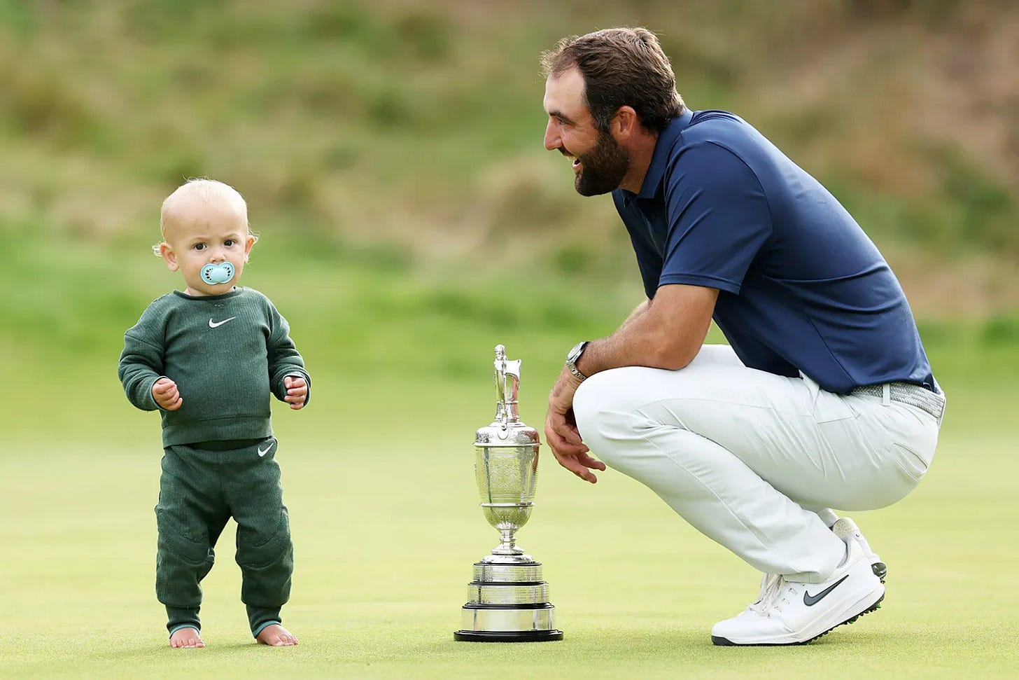 Scottie Scheffler of the United States celebrates with his son Bennett Scheffler and the Claret Jug on the 18th green after winning The 153rd Open Championship at Royal Portrush Golf Club on July 20, 2025 in Portrush, Northern Ireland Scottie Scheffler of the United States celebrates with his son Bennett Scheffler and the Claret Jug on the 18th green after winning The 153rd Open Championship at Royal Portrush Golf Club on July 20, 2025 in Portrush, Northern Ireland
