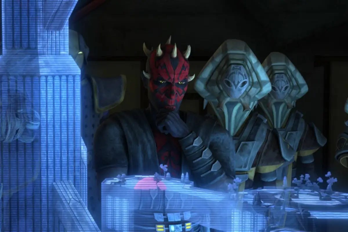 Maul and Pykes observe a hologram.