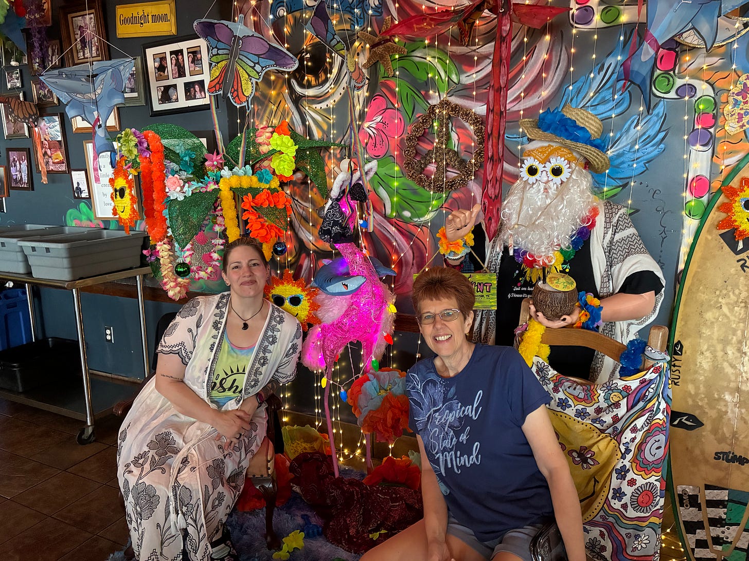 Interior of Gypsy Joynt restaurant in Galveston, complete with colorful painted walls and a life-sized Santa Claus holding a tropical drink in a coconut