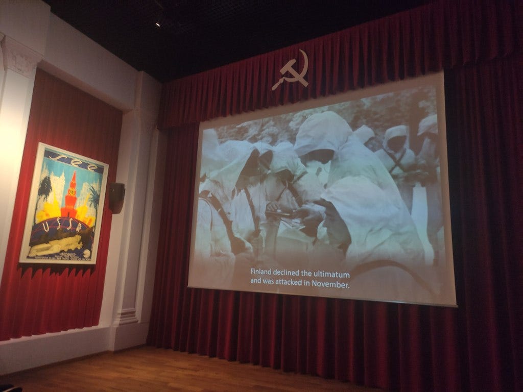 A video screen with a film giving an overview of WW2 action